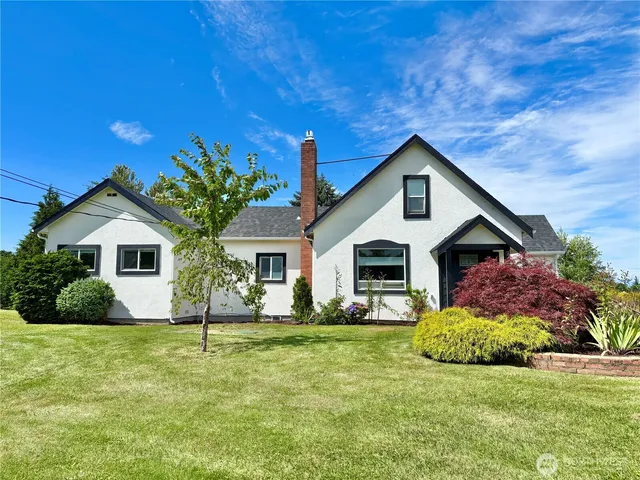 a view of swimming pool with a table and chairs
