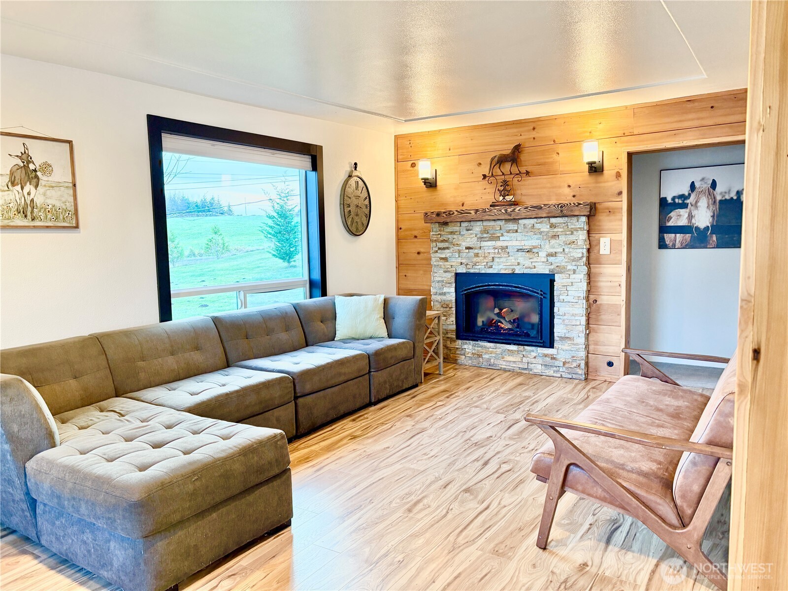 2452 Aldergrove Road Ferndale, WA 98248 - Photo 3 of 37 a living room with furniture and a fireplace