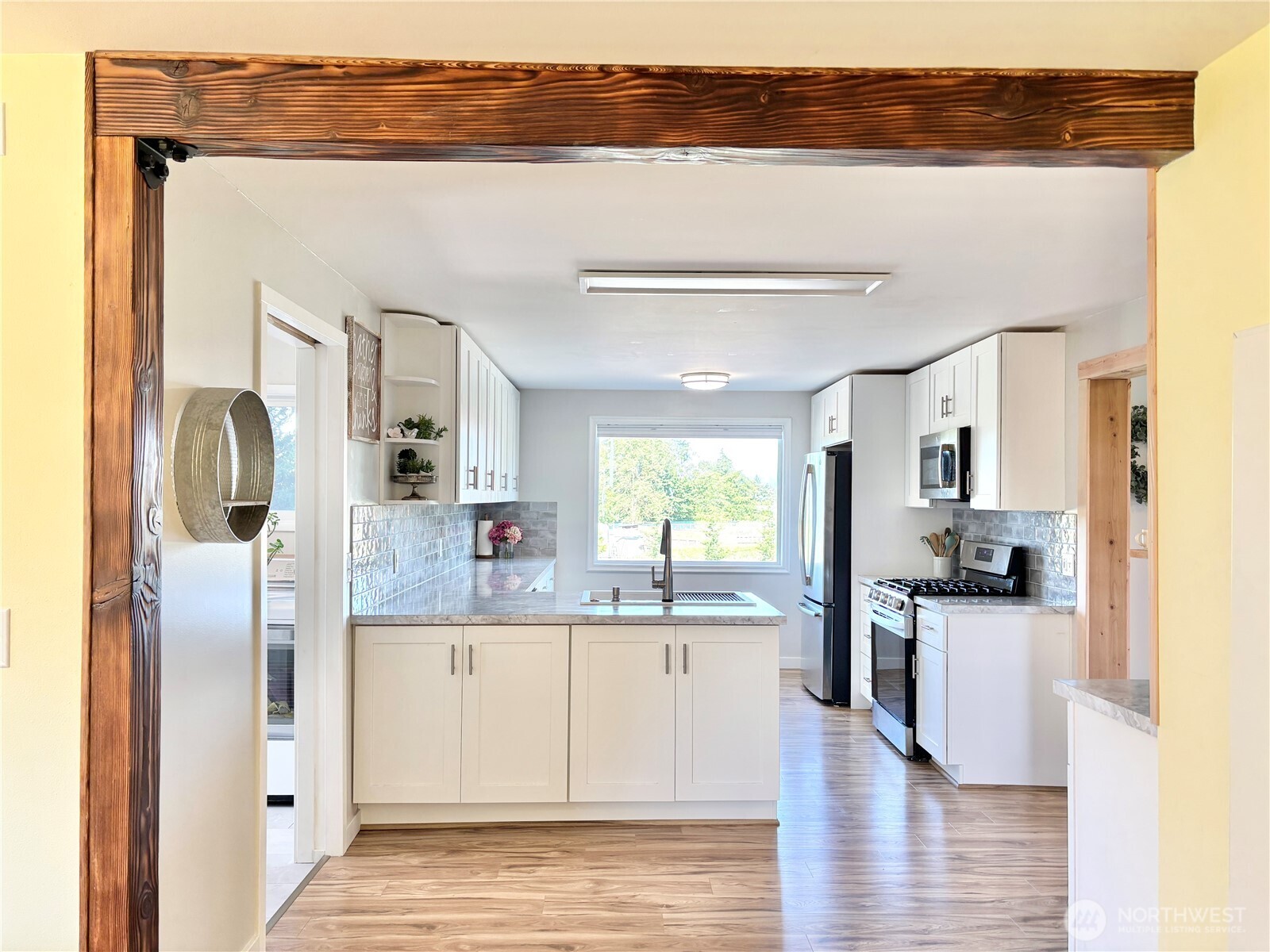 2452 Aldergrove Road Ferndale, WA 98248 - Photo 5 of 37 a kitchen with stainless steel appliances granite countertop a refrigerator and a sink