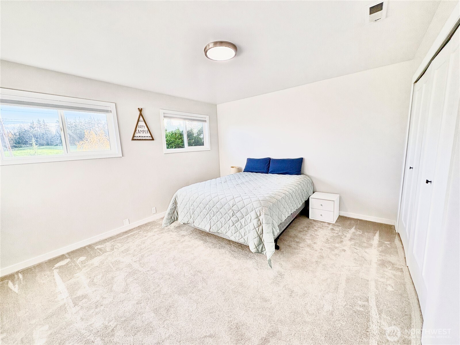 2452 Aldergrove Road Ferndale, WA 98248 - Photo 10 of 37 a bedroom with a bed and a painting on the wall