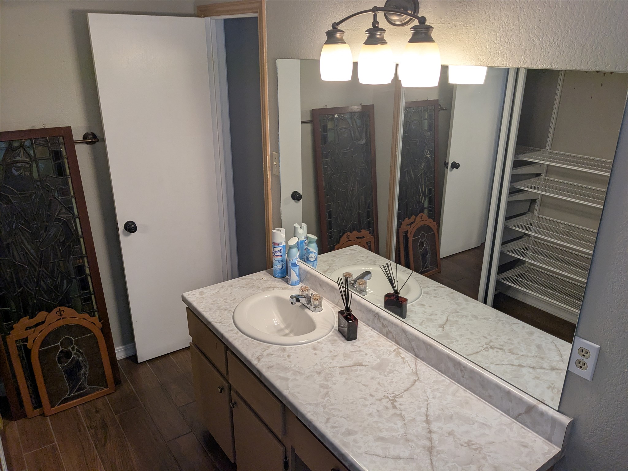 2502 Charla Circle Austin, TX 78728 - Photo 7 of 14 A well-appointed bathroom vanity with ample counter space and mirrored storage.