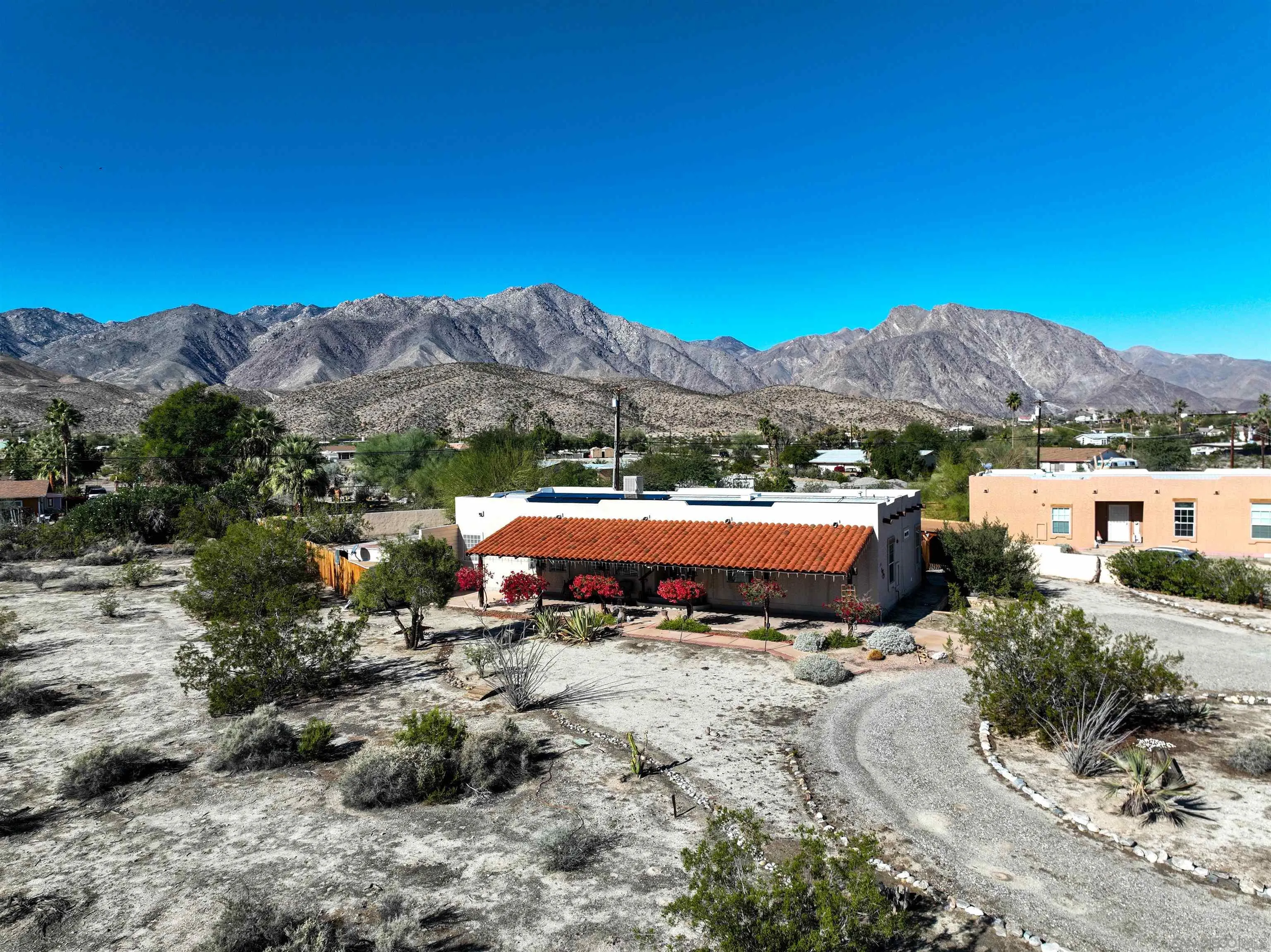 a swimming pool with mountain view in back