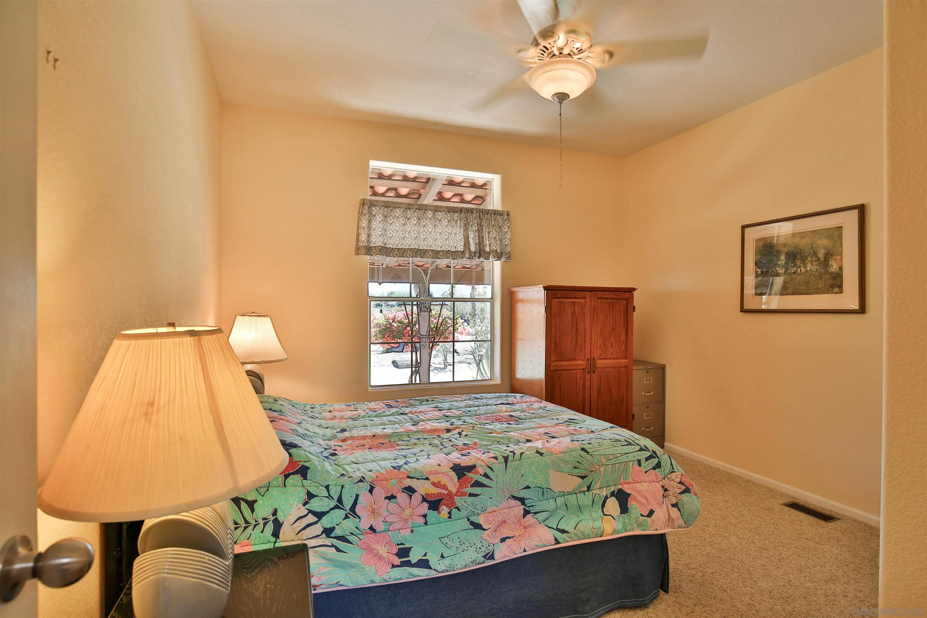 2846 Frying Pan Road Borrego Springs, CA 92004 - Photo 14 of 27 a bedroom with a bed and dresser with mirror