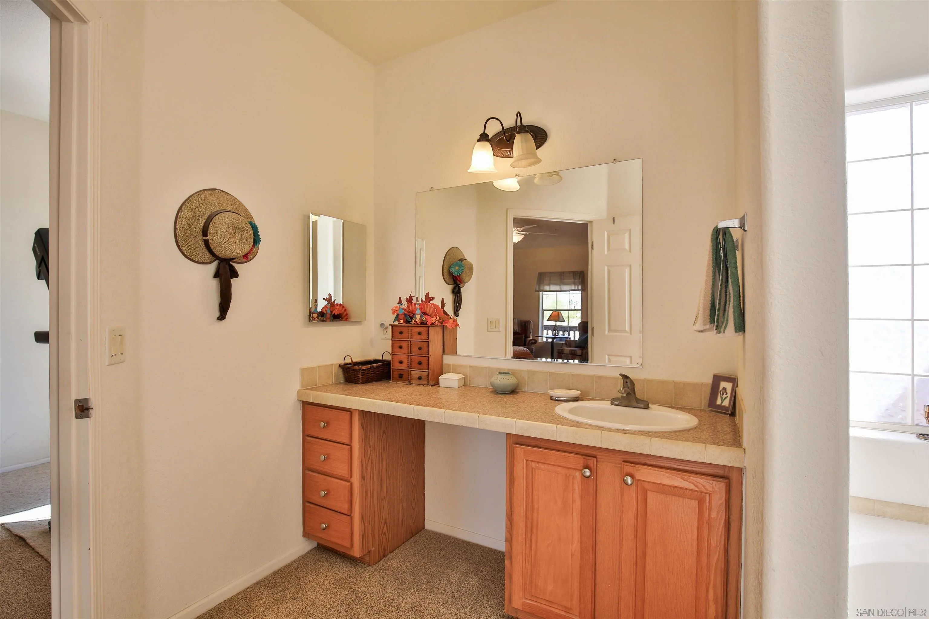 2846 Frying Pan Road Borrego Springs, CA 92004 - Photo 22 of 27 a bathroom with a double vanity sink and a mirror