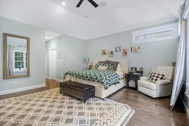 a bedroom with furniture and white walls