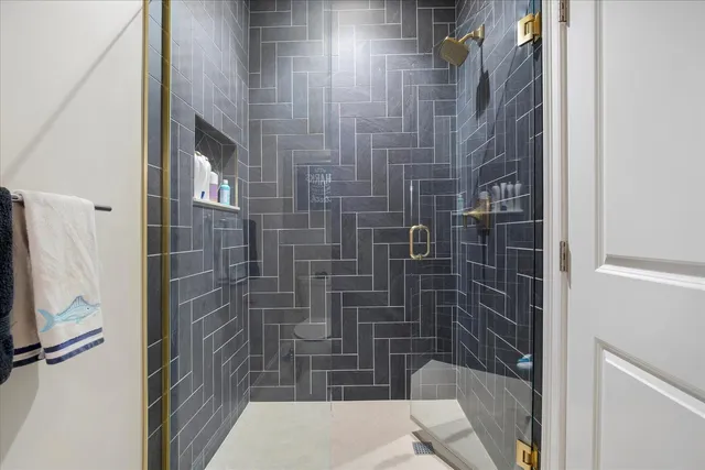 a bathroom with a toilet sink vanity and mirror