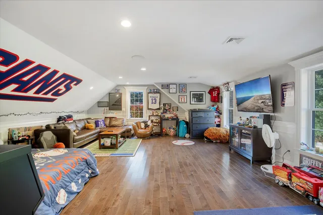 a living room with furniture and large windows