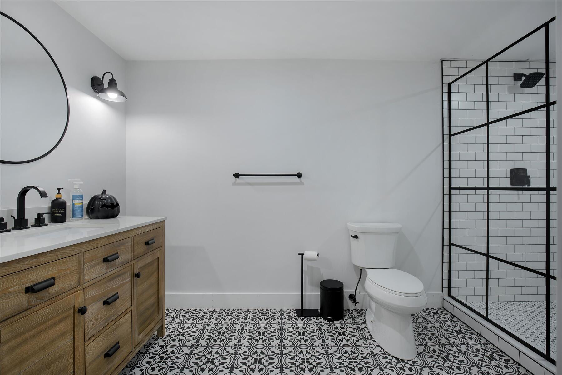 35 Spinnaker Drive West Mashpee, MA 02649 - Photo 37 of 59 a bathroom with a toilet a sink and mirror