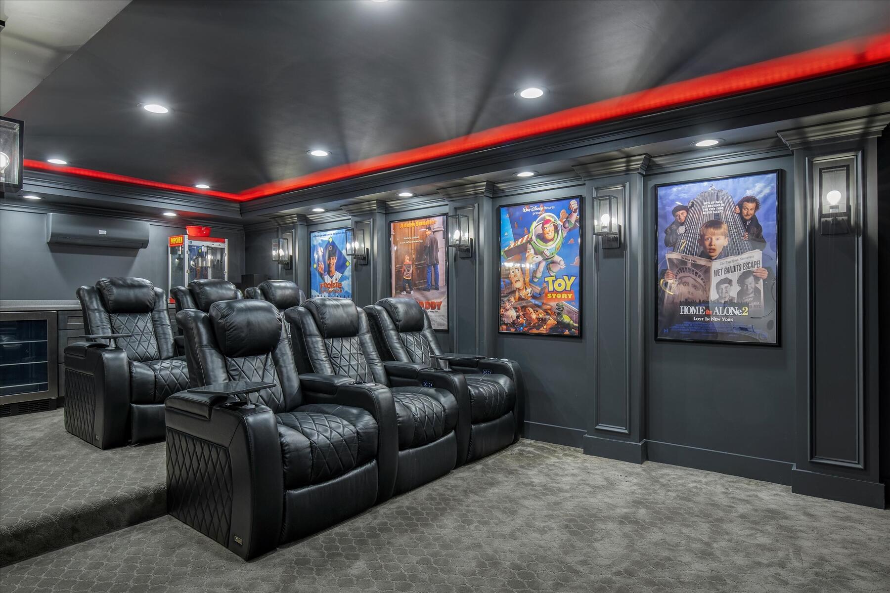 35 Spinnaker Drive West Mashpee, MA 02649 - Photo 40 of 59 a media room with lots of chairs and a projector