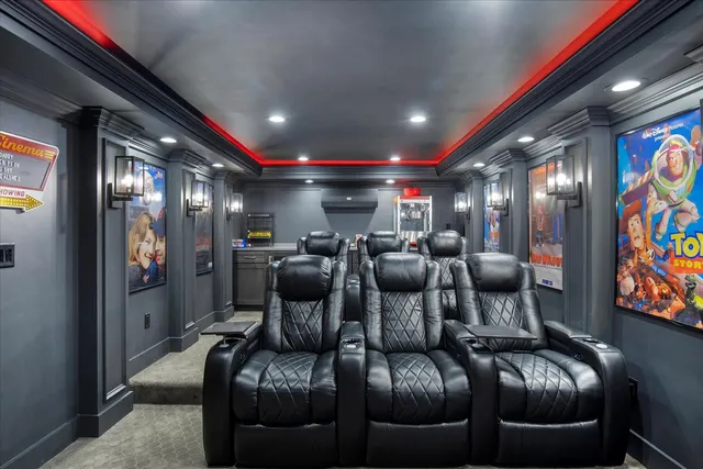 a living room with lots of furniture and kitchen view