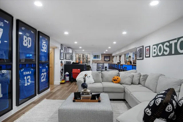 a front view of a house with a yard and trees