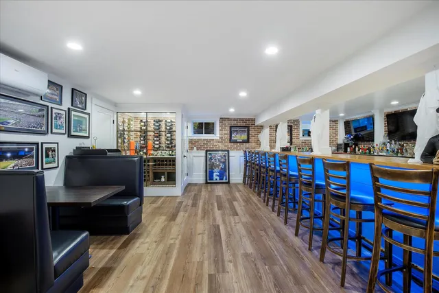 a view of a patio with couches table and chairs and potted plants