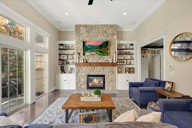 a living room with furniture and a fireplace