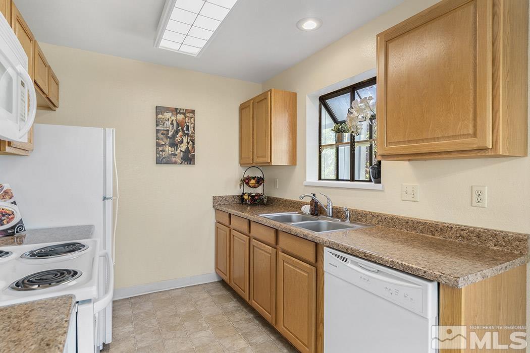 3943 Kings Row Reno, NV 89503 - Photo 11 of 16 a kitchen with a sink stove and cabinets
