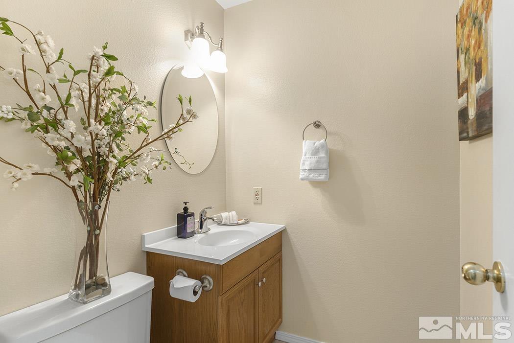 3943 Kings Row Reno, NV 89503 - Photo 13 of 16 a bathroom with a sink and a mirror