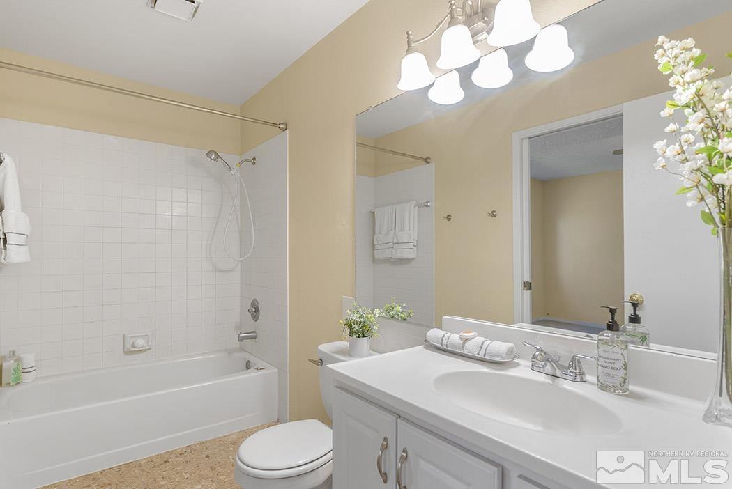 3943 Kings Row Reno, NV 89503 - Photo 14 of 16 a bathroom with a sink a toilet and a bathtub