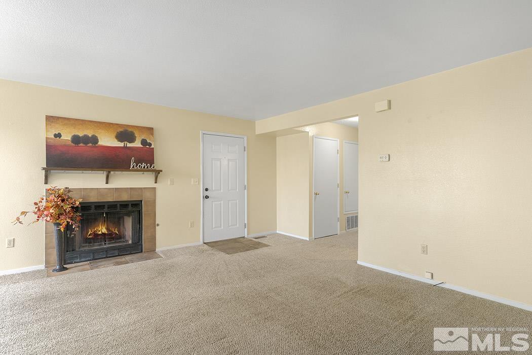 3943 Kings Row Reno, NV 89503 - Photo 7 of 16 a view of an empty room with a fireplace