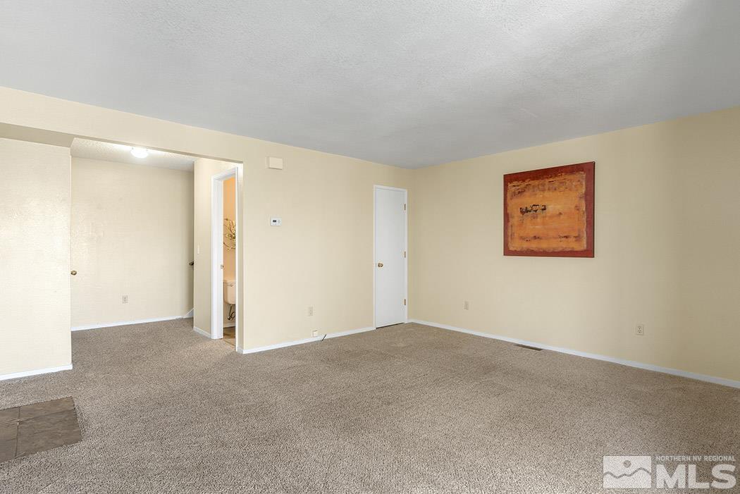 3943 Kings Row Reno, NV 89503 - Photo 8 of 16 an empty room with a hallway
