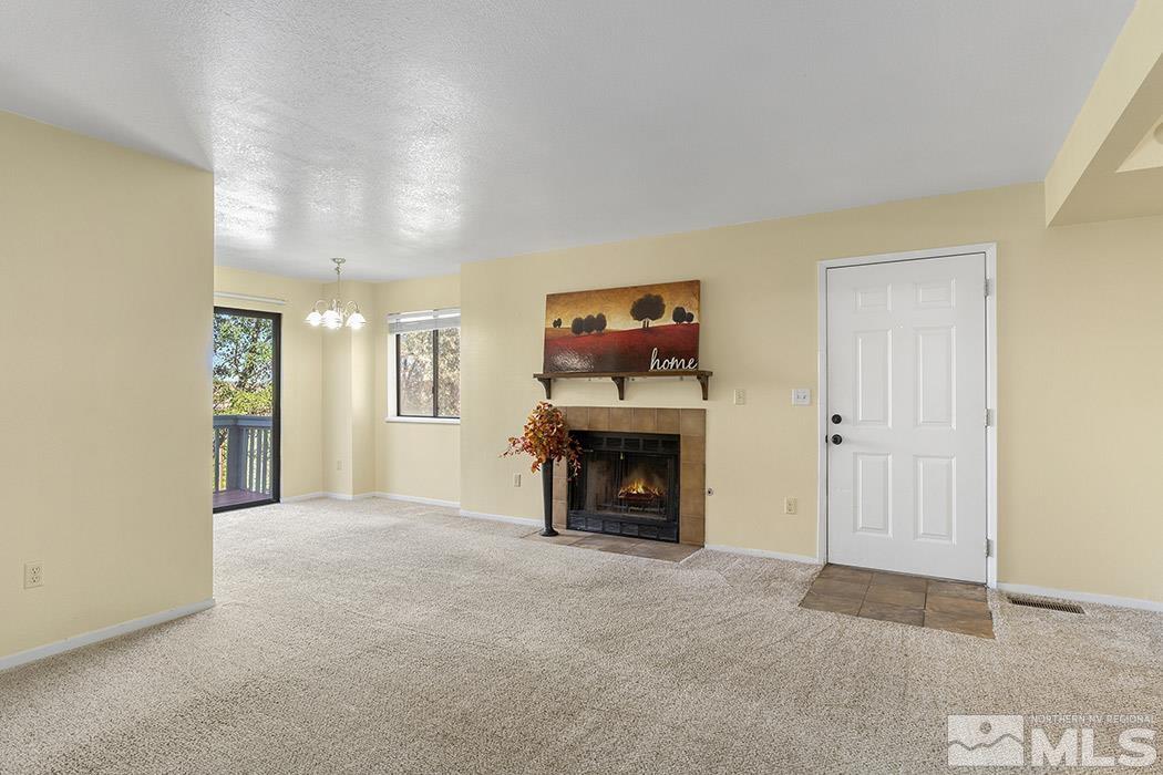 3943 Kings Row Reno, NV 89503 - Photo 9 of 16 a view of an empty room with a fireplace