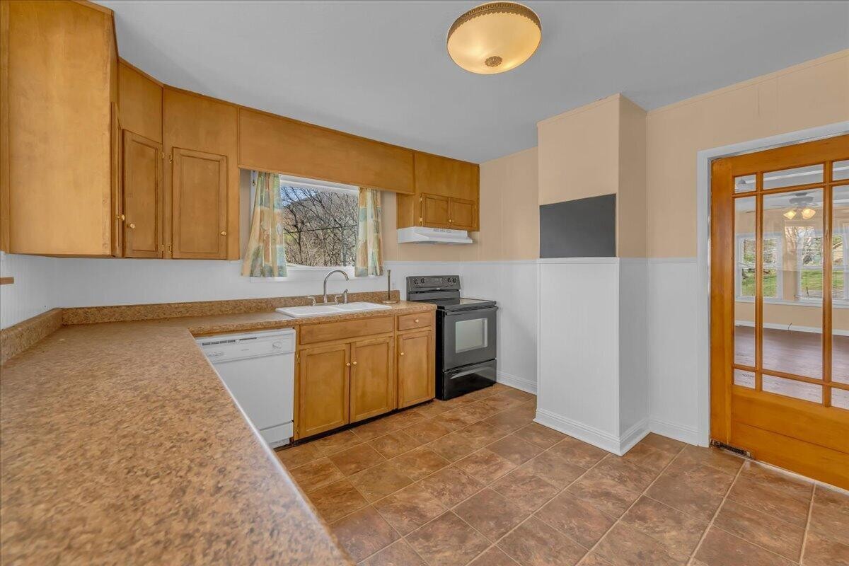 120 Raulstontown Road South Pittsburg, TN 37380 - Photo 12 of 22 a kitchen with a sink cabinets and window