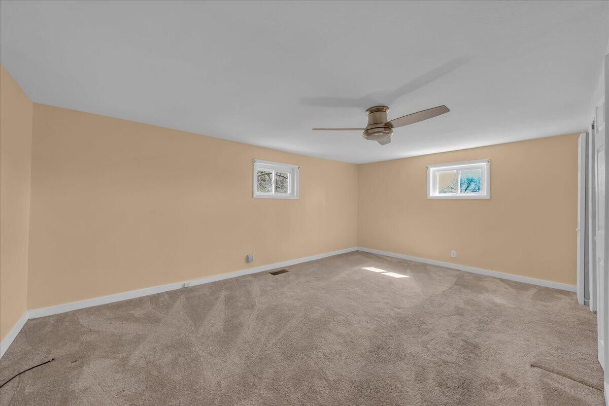 120 Raulstontown Road South Pittsburg, TN 37380 - Photo 15 of 22 an empty room with a ceiling fan and a window