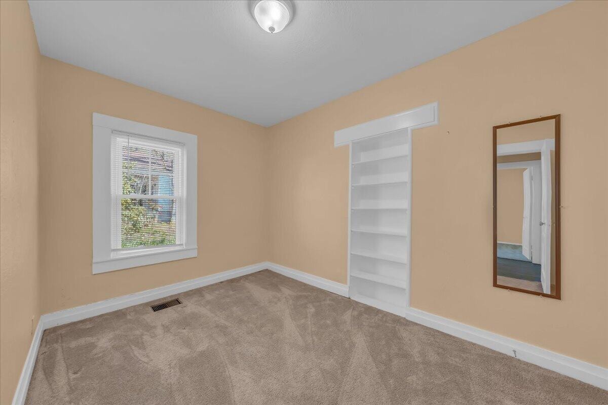 120 Raulstontown Road South Pittsburg, TN 37380 - Photo 18 of 22 an empty room with windows and closet