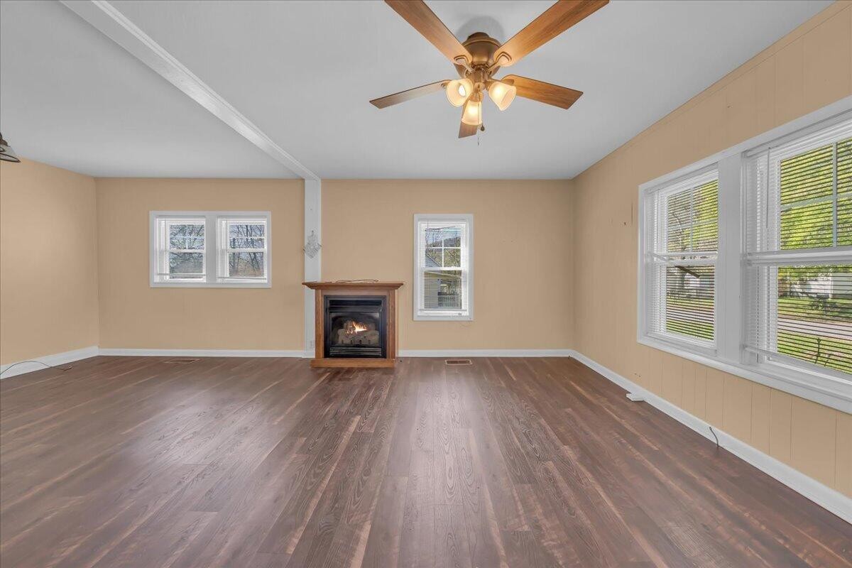 120 Raulstontown Road South Pittsburg, TN 37380 - Photo 6 of 22 wooden floor in an empty room with a window