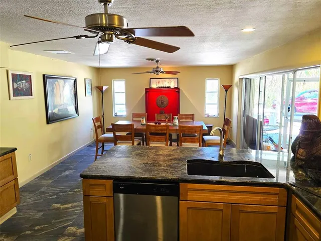 a kitchen with a stove and a chandelier