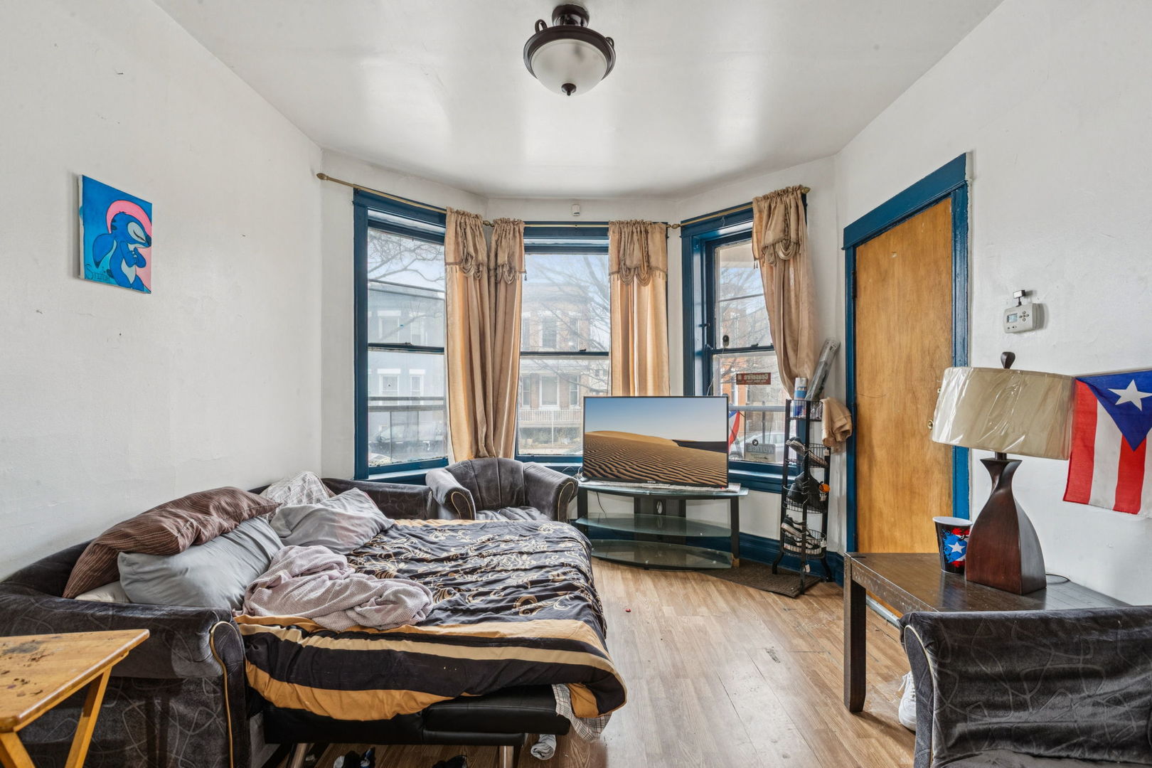 1012 North Ridgeway Avenue Chicago, IL 60651 - Photo 12 of 31 a bedroom with a bed and wooden floor