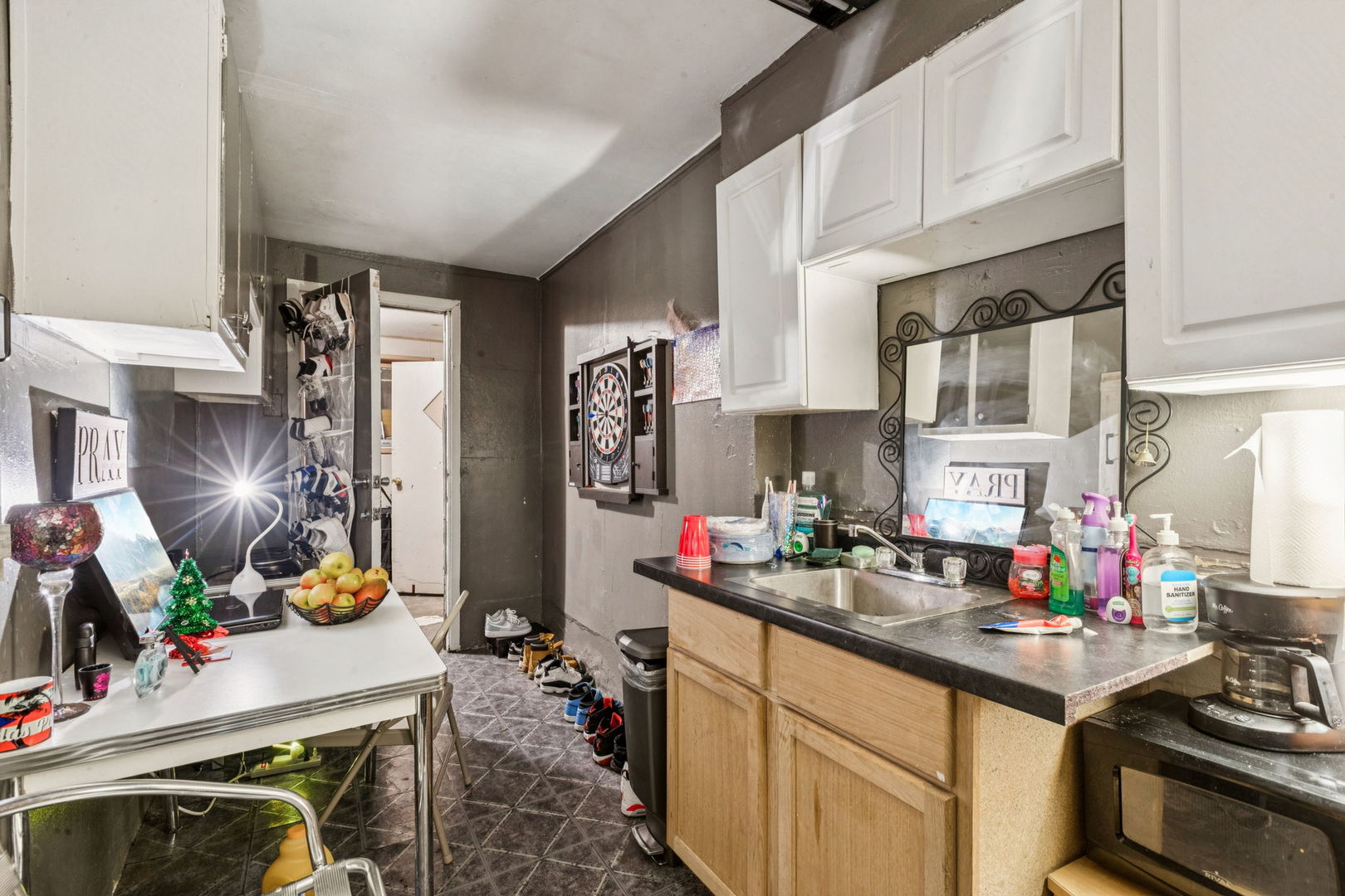 1012 North Ridgeway Avenue Chicago, IL 60651 - Photo 23 of 31 a kitchen with a sink stove and cabinets