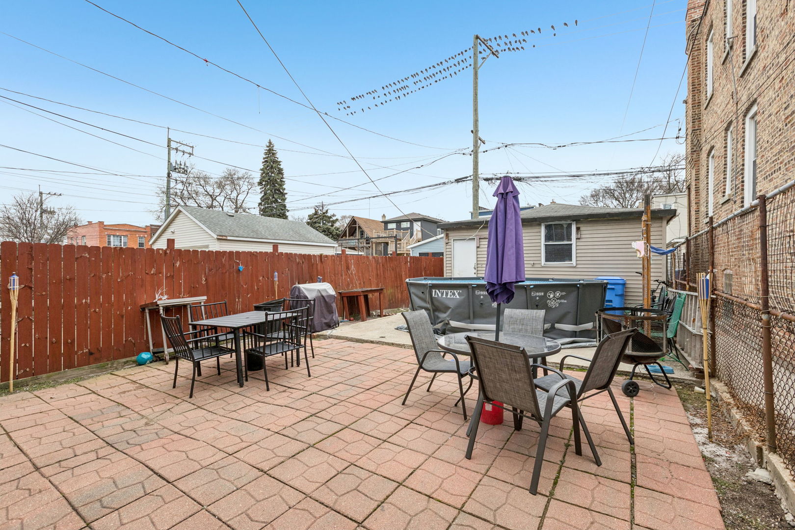 1012 North Ridgeway Avenue Chicago, IL 60651 - Photo 30 of 31 a view of a patio with table and chairs