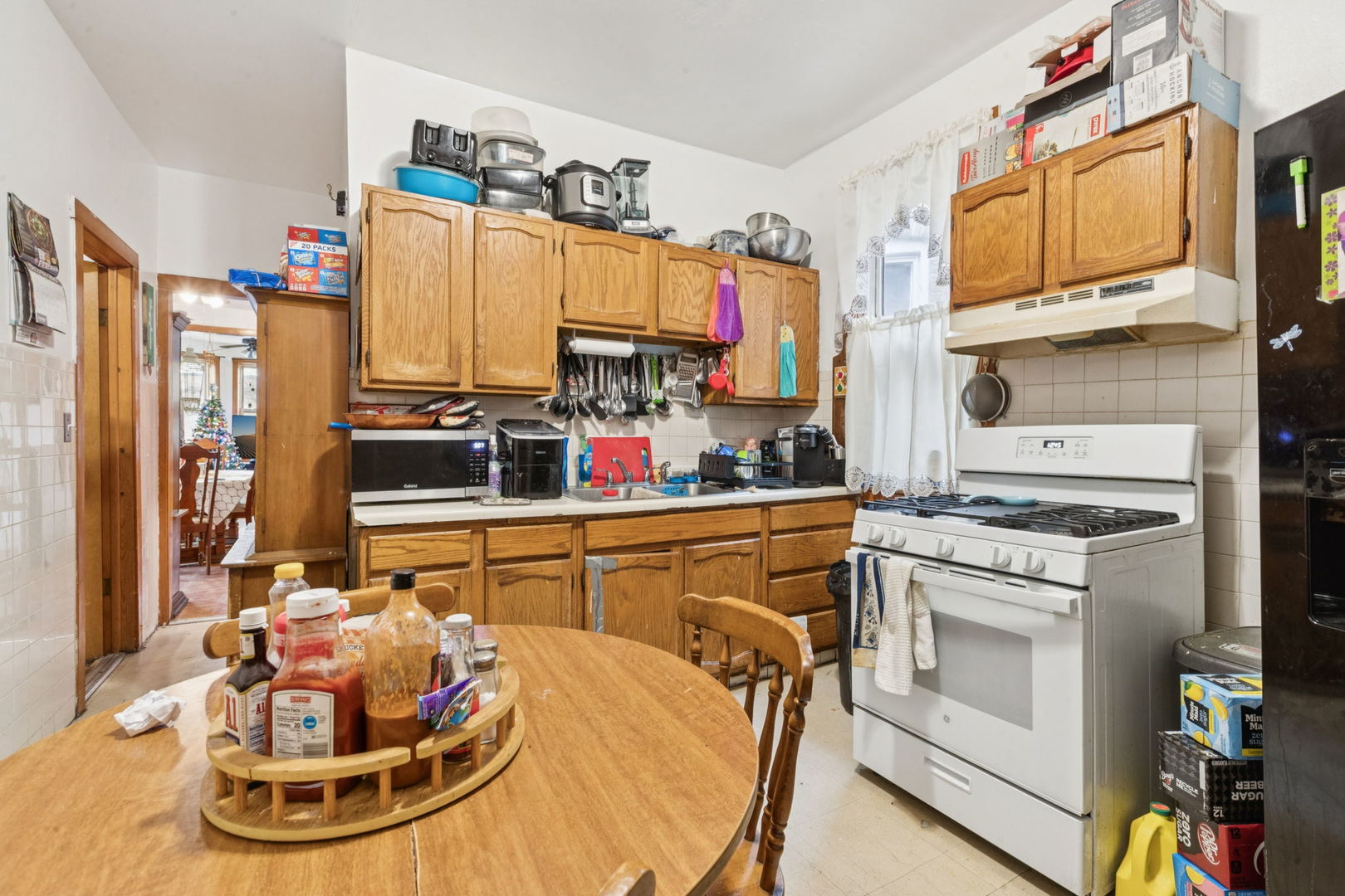 1012 North Ridgeway Avenue Chicago, IL 60651 - Photo 4 of 31 a kitchen with stainless steel appliances granite countertop a stove a sink and a refrigerator