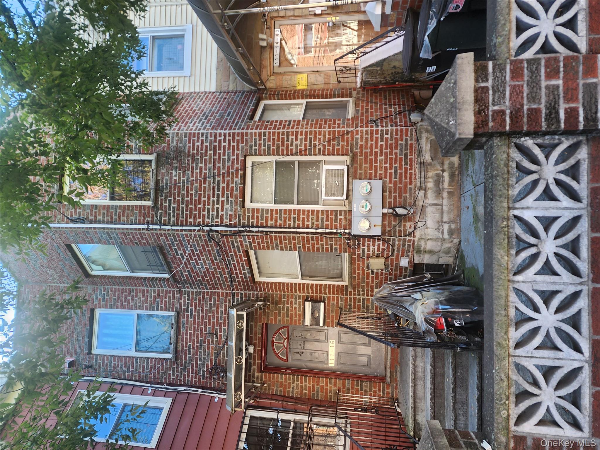 View of front of house with brick siding