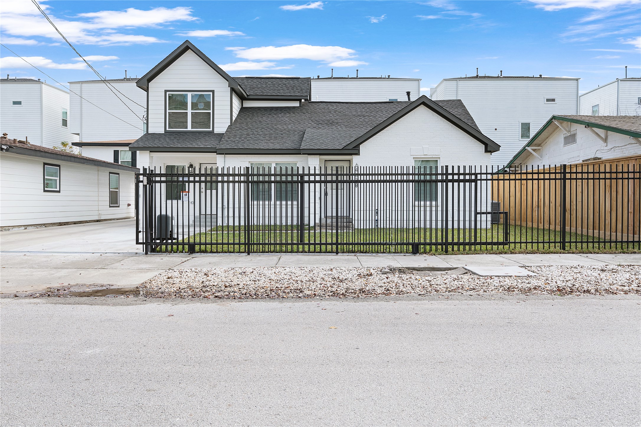 a view of a town with wooden fence