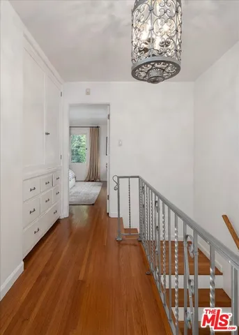 a view of a hallway with windows