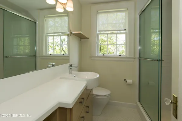 a bathroom with a sink a toilet and tub
