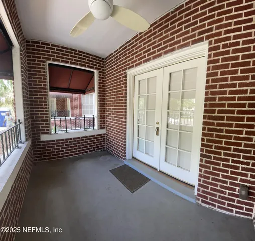 a view of empty room with windows