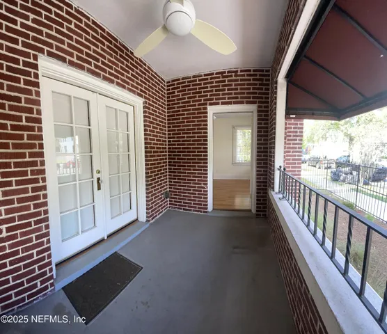 a view of a brick house with wooden floor