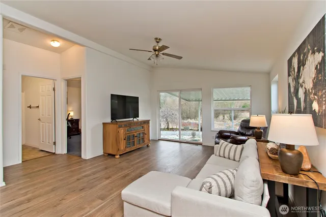a bedroom with bed and a chandelier