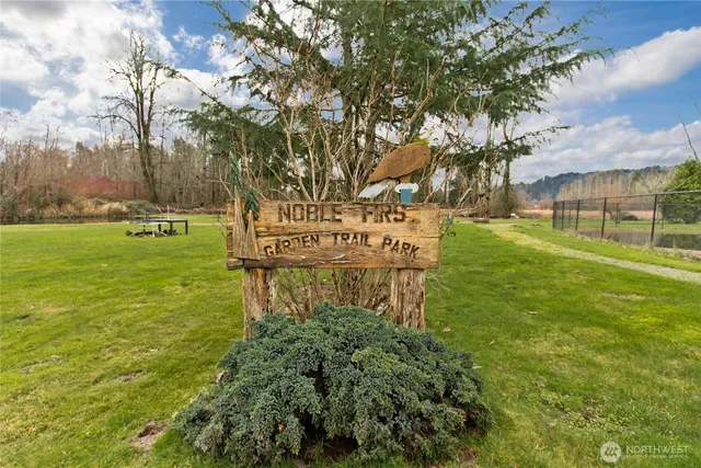 a view of a porch with furniture and a yard