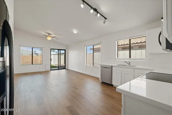 a view of a kitchen and a sink dishwasher and a fireplace