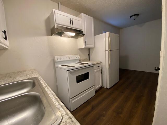 1310 54th Street, Unit 7 Lubbock, TX 79412 - Photo 3 of 7 a kitchen with a refrigerator sink and stove