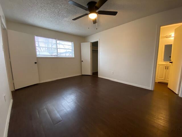 1310 54th Street, Unit 7 Lubbock, TX 79412 - Photo 5 of 7 a view of an empty room with wooden floor and a window