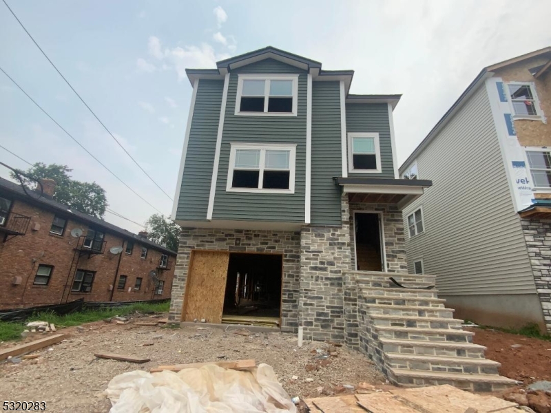307 Chilton Street Elizabeth, NJ 07208 - Photo 2 of 10 a front view of a house with a yard