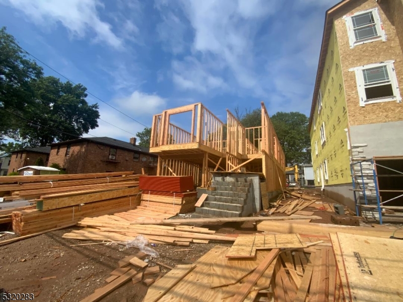307 Chilton Street Elizabeth, NJ 07208 - Photo 5 of 10 a view of a building with many windows