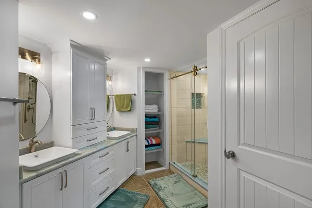 a bathroom with a double vanity sink mirror and double