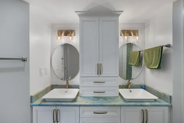 a bathroom with a sink and a mirror