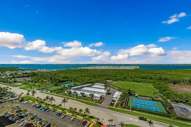 a view of a city street next to a yard