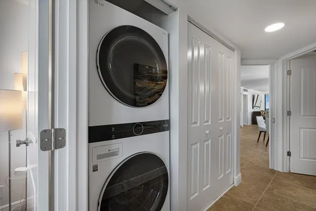 a view of a hallway with washer and dryer