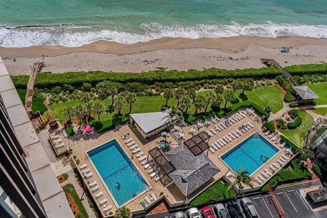 an aerial view of a house with a garden